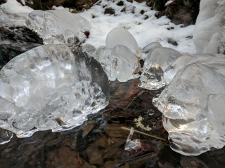 ice balls in partially frozen creek